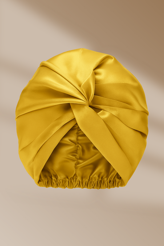 Goudkleurige zijden bonnet met twist-design – luxueuze haarbescherming voor de nacht met Empowherment